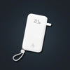 Kombo 3 in 1 Power Bank 20,000mAh with foldable AC plug, 22.5W fast charging, and dual built-in charging cables.
